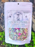 Package of 'Holy Smokes' Sacred Smoke blend on a natural background with herbs visible